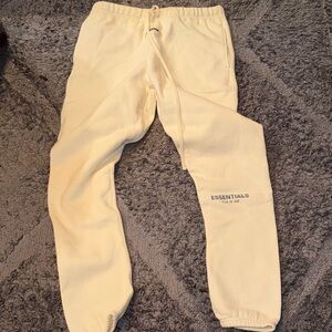 Fear of God Essentials cream joggers